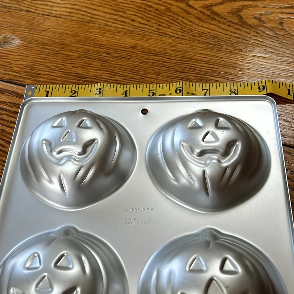 Wilton 4 in 1 Jack-O-Lantern Halloween theme molds/cake pans.  Dated 1990.